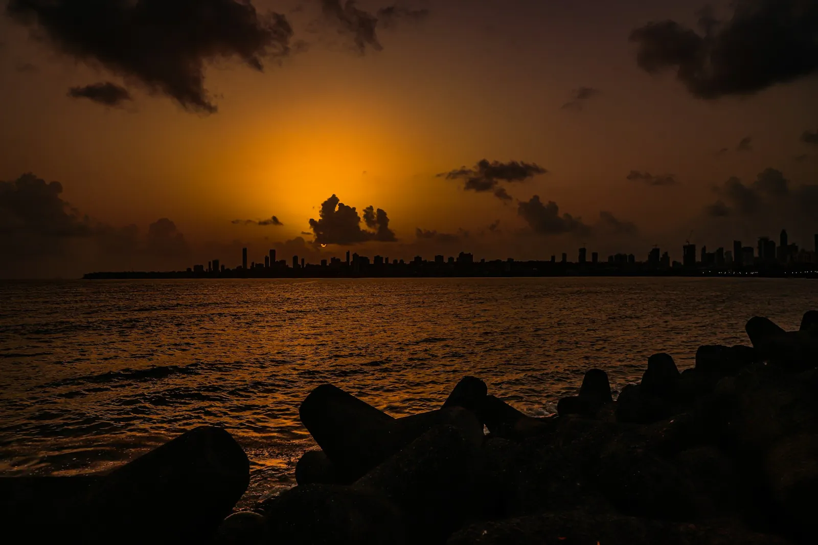 Marine Drive skyline at sunset over the tetrapods